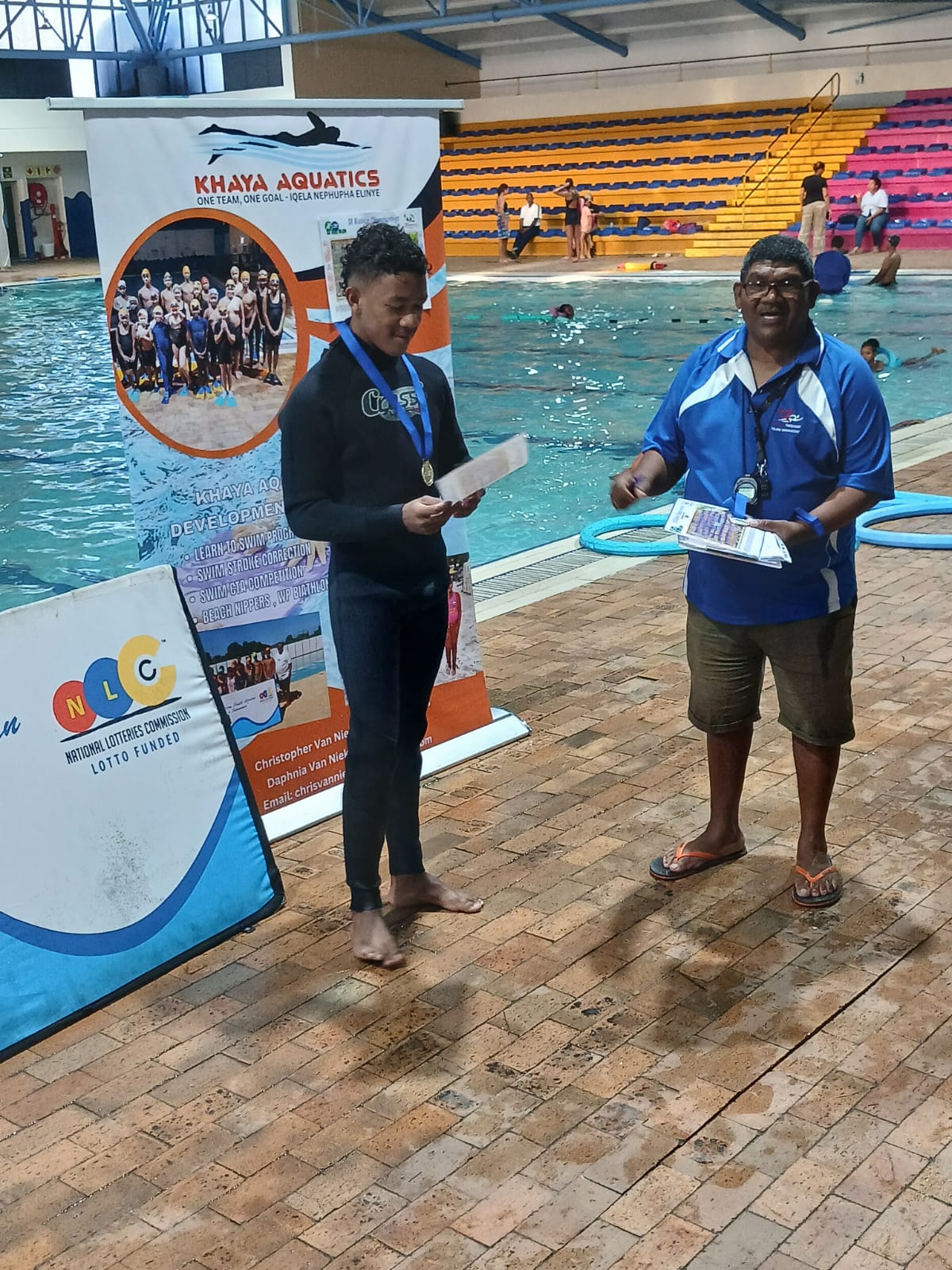 Medal handover and recognition moment at Family Fun Day