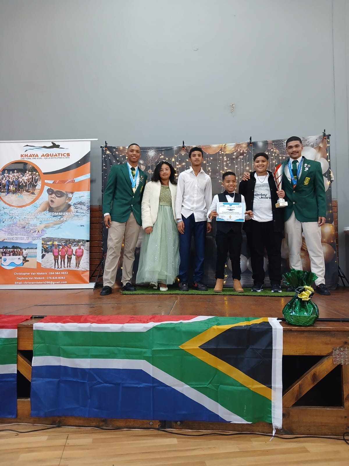 Khaya Aquatics swimmer receiving certificate recognition