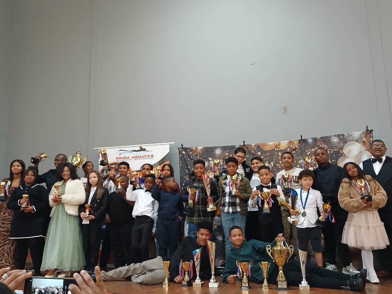 Khaya Aquatics whole team with trophies at the awards ceremony